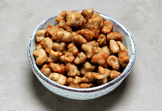 Pieces of sausage pizza topping